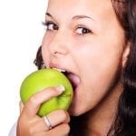 girl eating apple Reflexology Healing Medfield MA