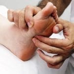 pressing on foot reflexology