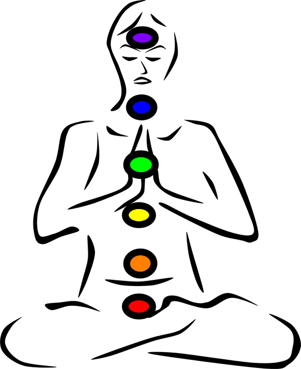 sitting person with chakras